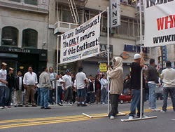 Here we prepare for the march to begin. We put up our signs to remind our people that this is our continent.